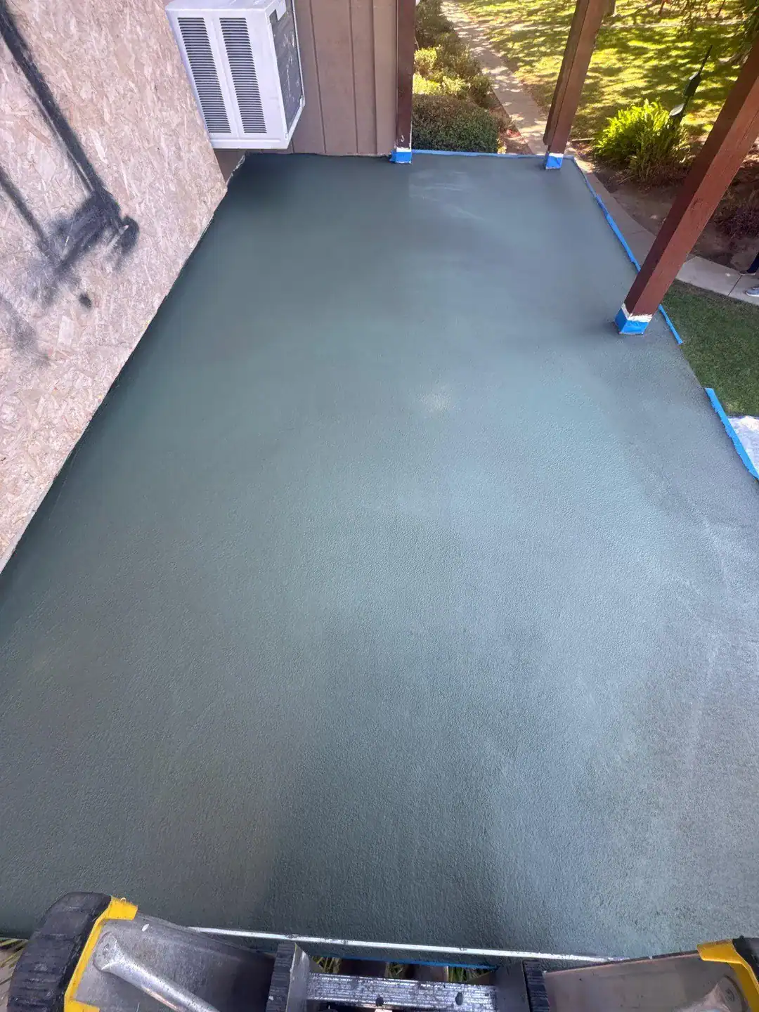 Balcony waterproofing repair in progress on a stripped and prepped deck