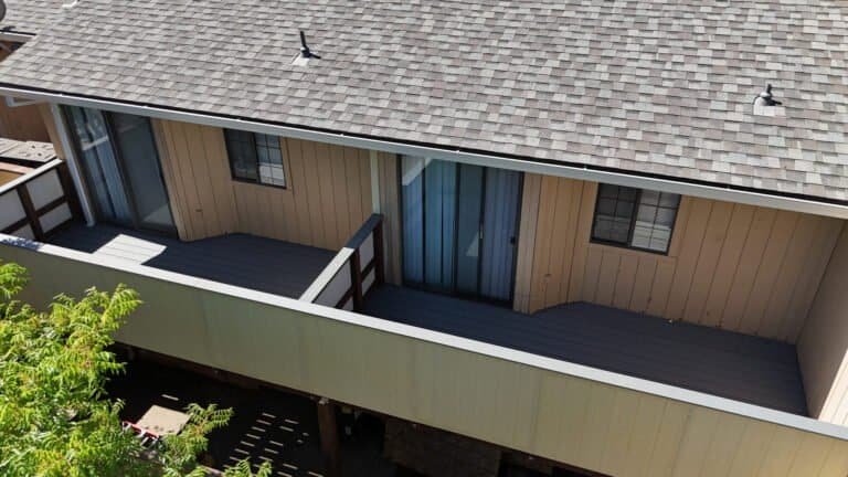 Aerial view of a run of replaced balconies along a two-story townhome building in Antelope