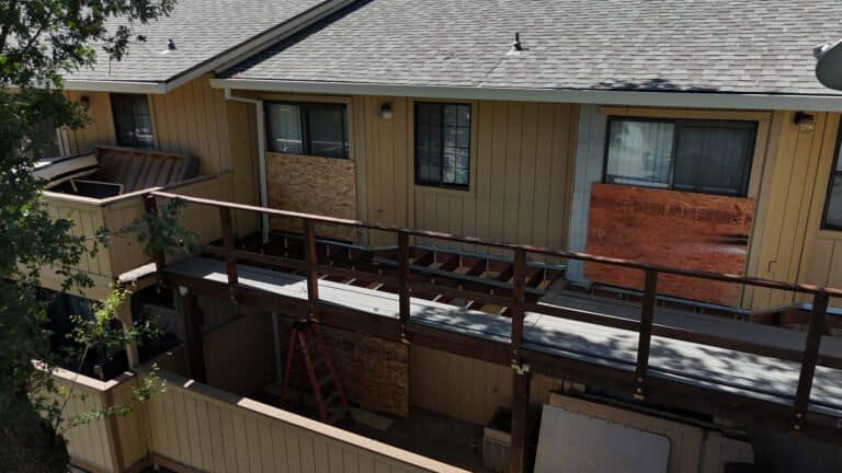 Aerial view of a two-story townhome building in Antelope with its second-floor balconies replaced