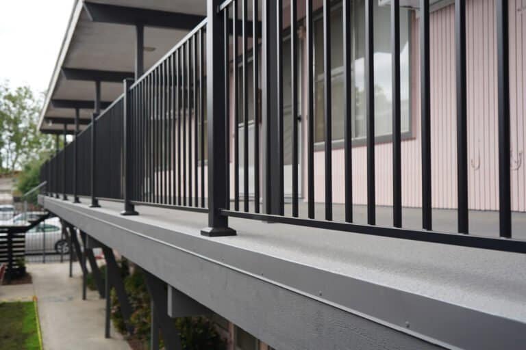 New guardrail and fascia line along a rebuilt elevated walkway
