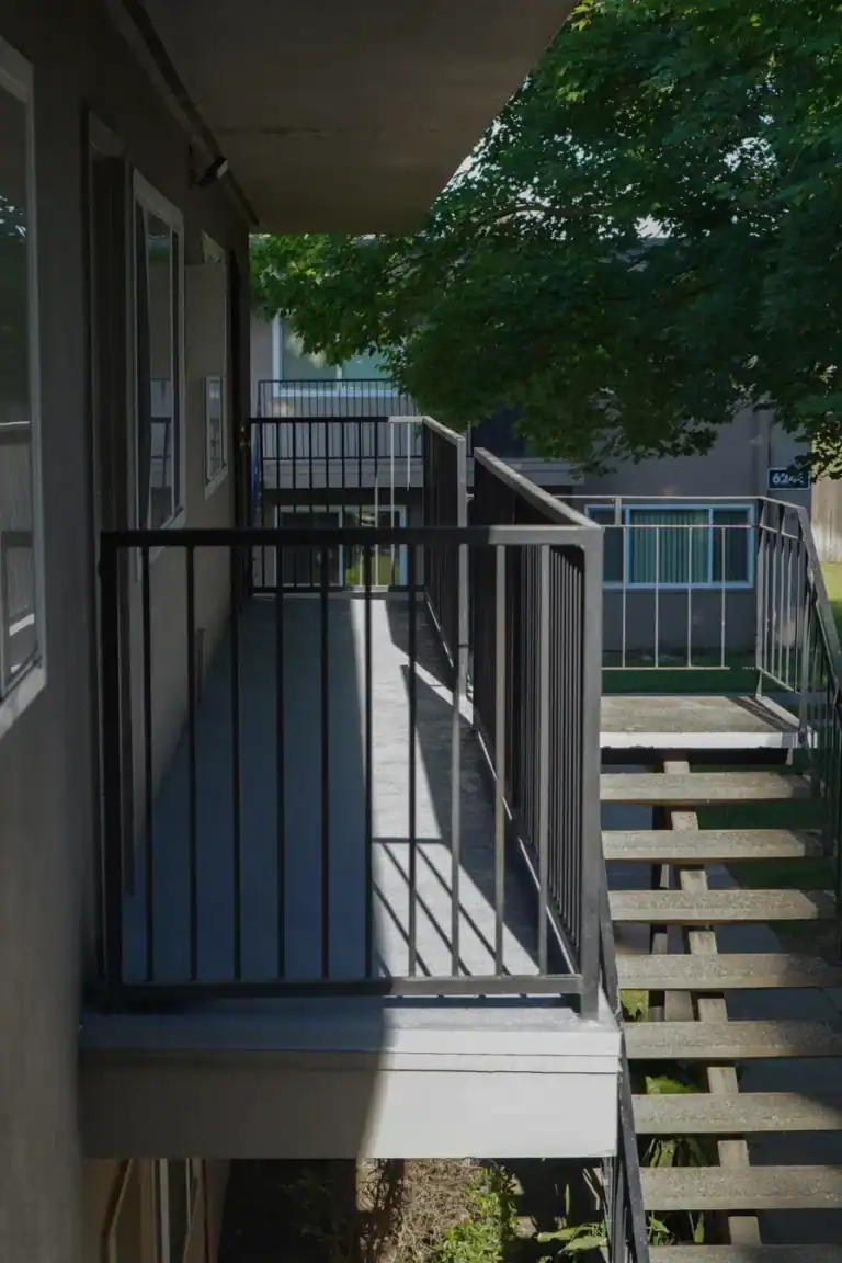 Coated walkway and stair landing at a Sacramento apartment property