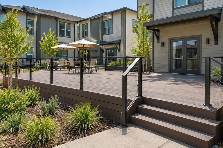 Decks Sacramento — elevated townhome deck with stair run and guardrail on an HOA property