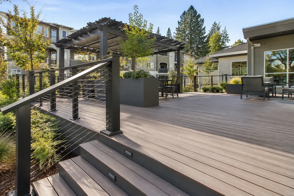 Deck builders Sacramento — rebuilt deck with cable guardrail, lighted stairs and shade structure