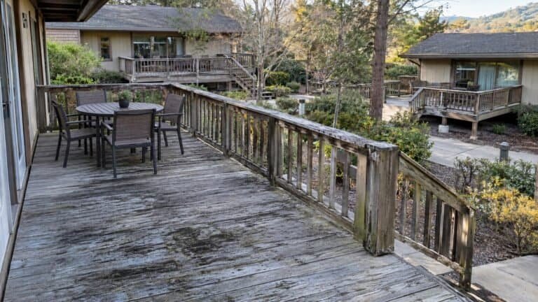 Weathered private deck and wood guardrail at a Los Altos residential community before rebuild