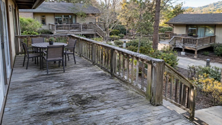 Weathered private deck and wood guardrail at a Los Altos residential community before rebuild