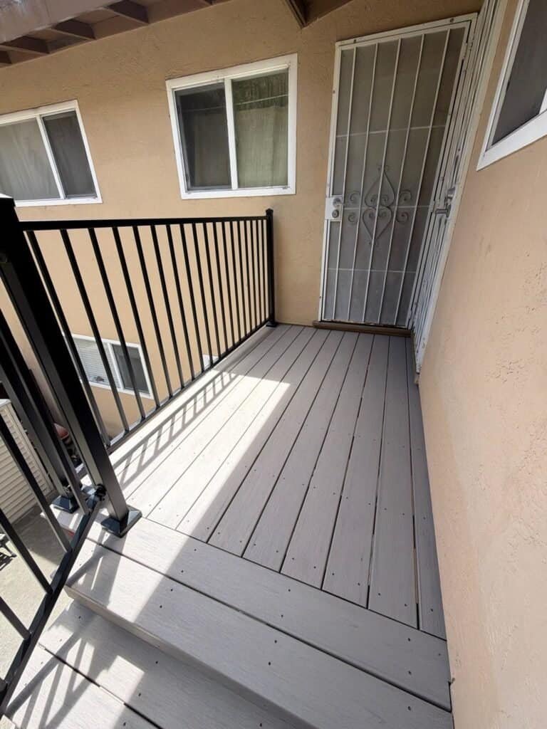 Upper landing at an apartment door in Oakland finished in Trex composite decking
