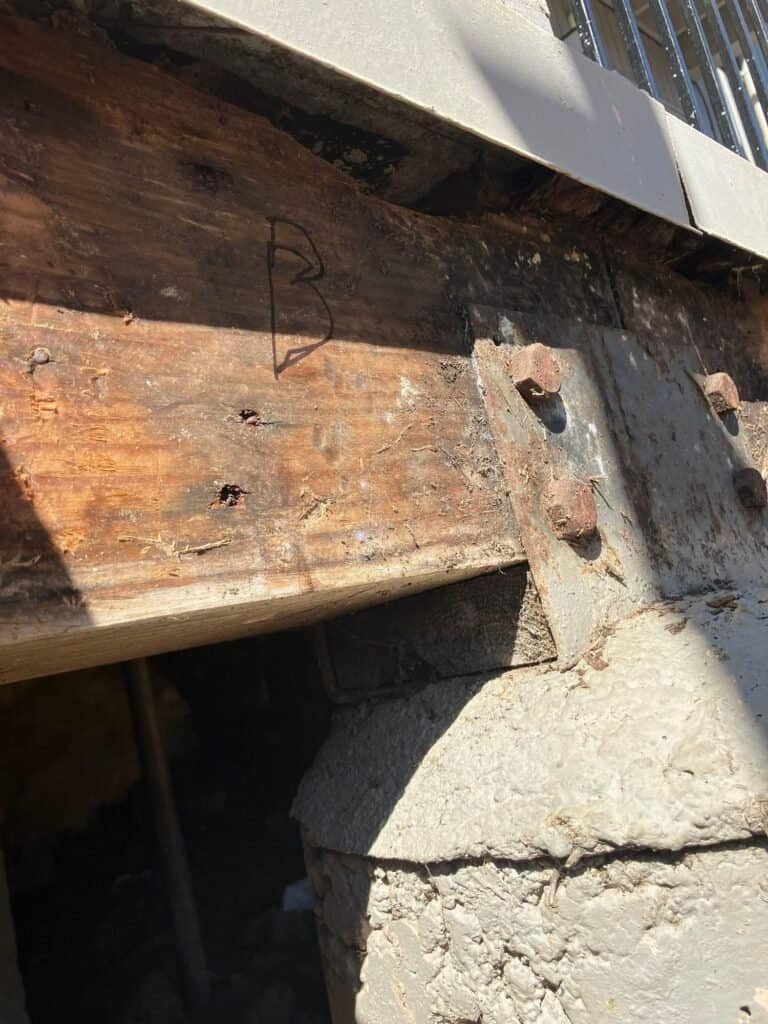Corroded bolts at a beam-to-post steel connector on a Rio Linda apartment balcony