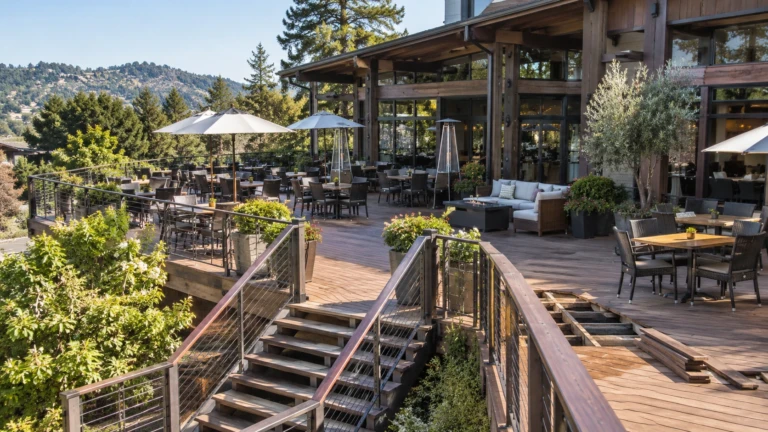 Multi-level elevated restaurant dining deck on a Saratoga hillside with cable railings and mountain views