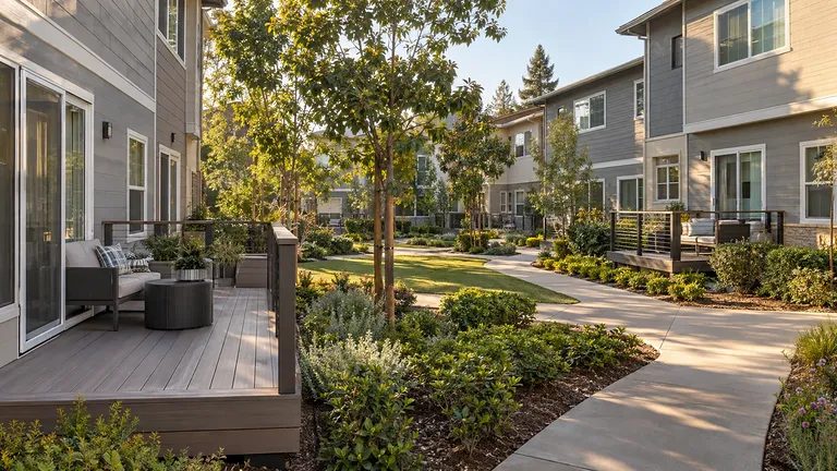 Trex deck Sacramento — composite townhome deck with cable railing facing a shared courtyard