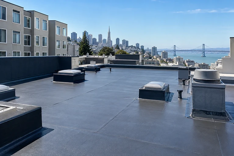 Waterproofing specialist San Francisco — coated roof terrace with skylights and flashed mechanical curbs