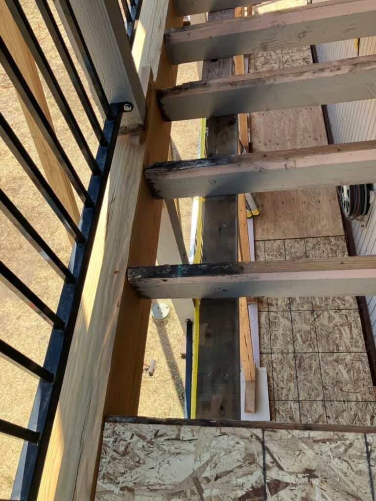 Replaced and sistered joists with new plywood sheathing during balcony framing repairs