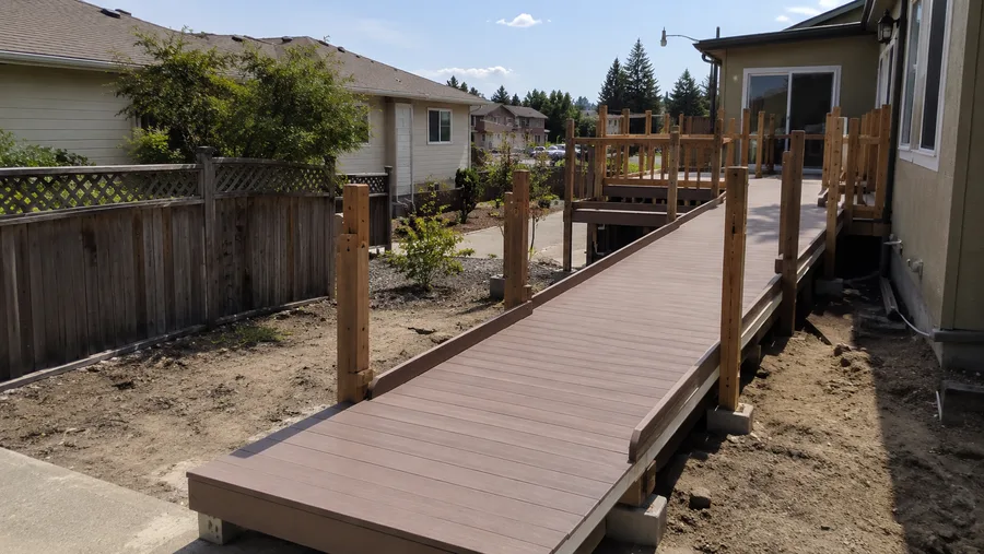 Long composite ramp run under construction, framed to reach a raised deck