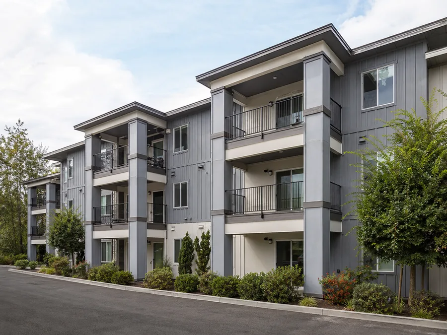 Recessed covered balconies set into the building elevation on every floor