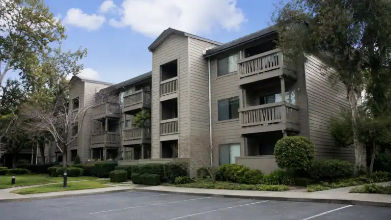 Three-story condominium community in California with wood-framed balconies on every unit