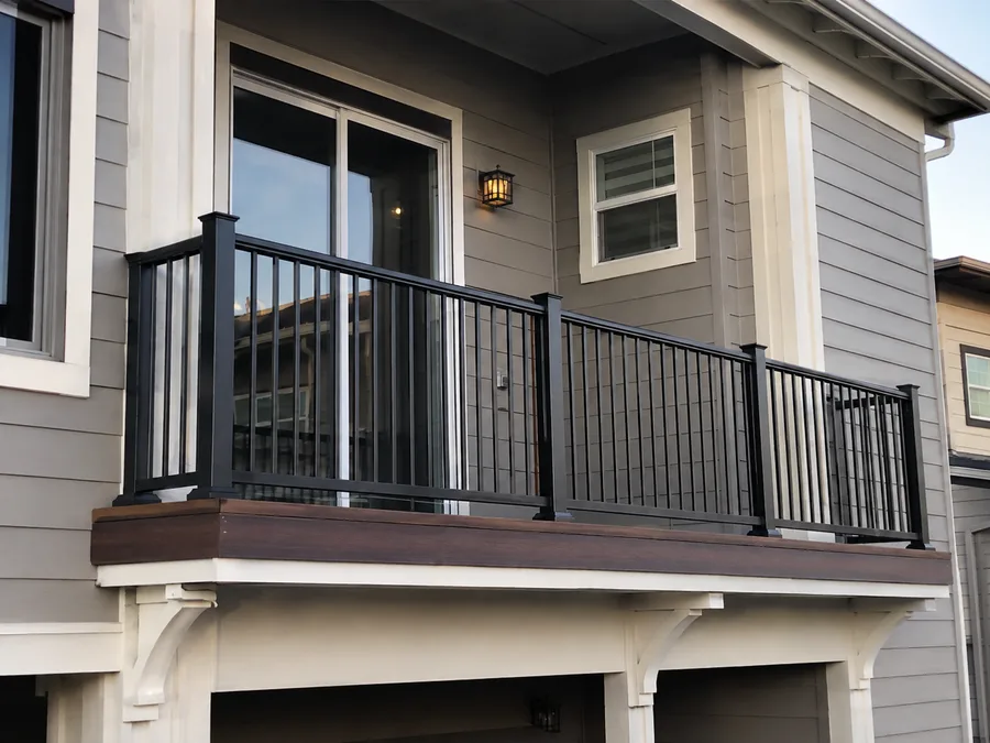 Powder-coated aluminum balcony railing with picket infill on a multifamily building