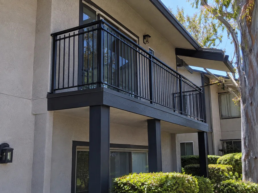 Replacement aluminum guardrail on a post-supported apartment balcony