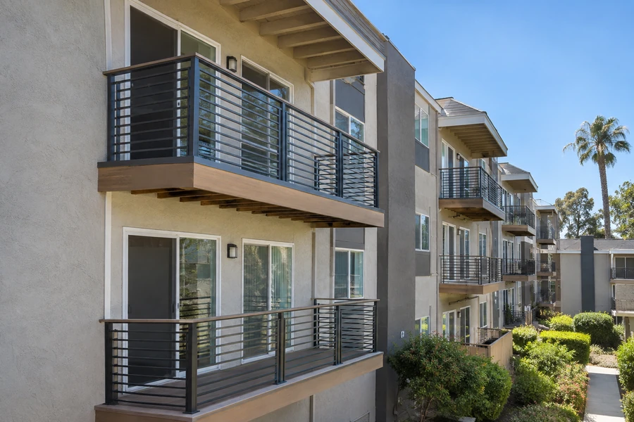 Balconies remodelled with horizontal-rail guardrails and timber-toned edges