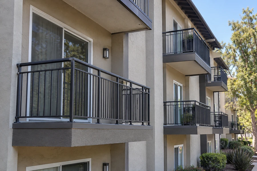 Apartment elevation after balcony renovation, new guardrails and refinished edges throughout