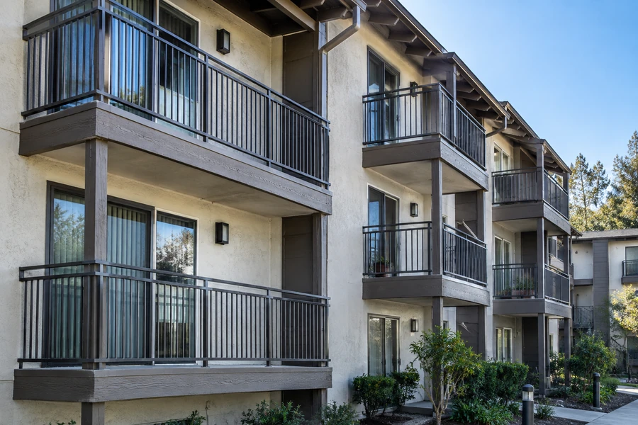 Condominium building with renovated balconies across three floors