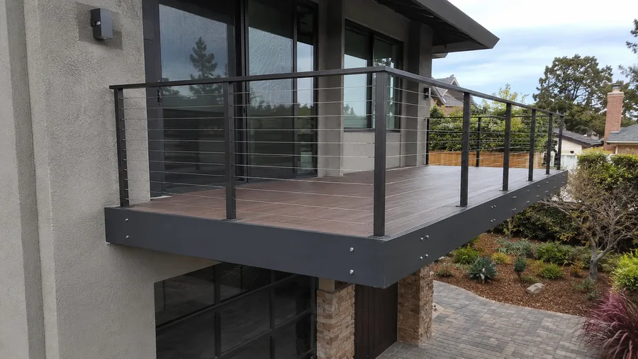 Steel-framed cantilever balcony with composite decking and cable guardrails