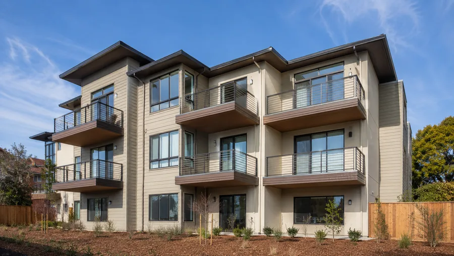 Multifamily building with cantilevered balconies on every unit and no supporting posts