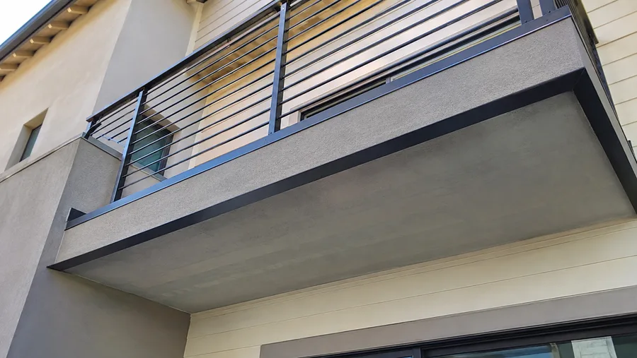 Underside of a cantilevered balcony showing a clear soffit with nothing carrying it below
