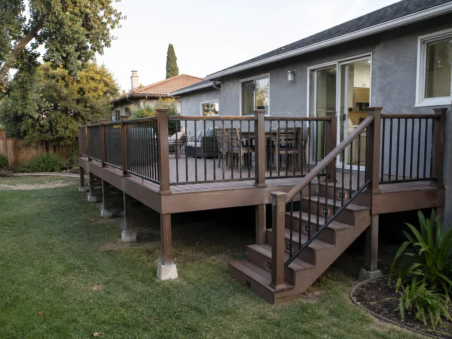 Enlarged deck with new railings, stair run and lit steps