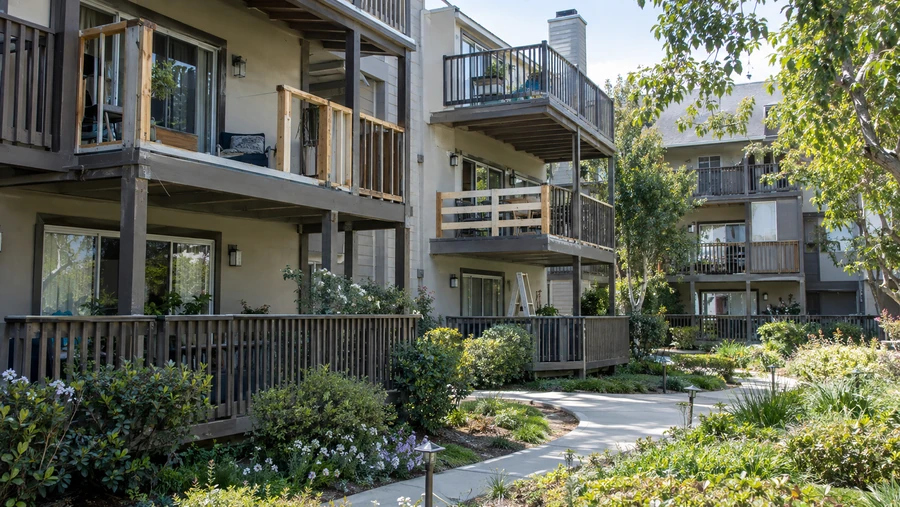 Apartment courtyard with railing repairs under way on several balconies at once