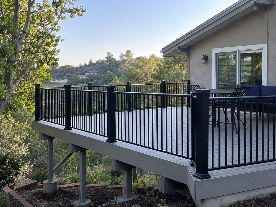 Replacement aluminum railing with black balusters on an elevated deck