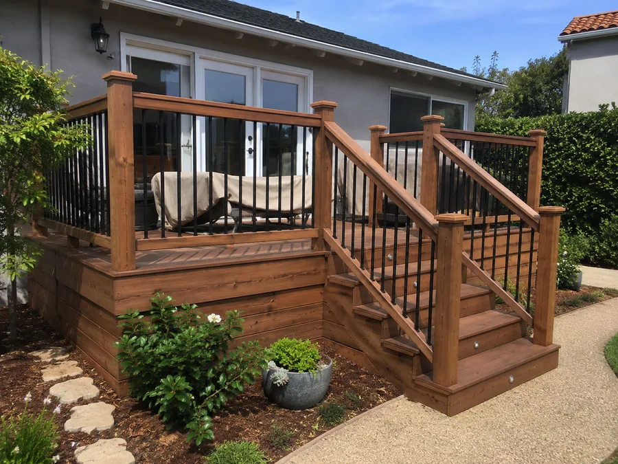 Deck with replacement railings and matching stair rail, in timber with metal balusters