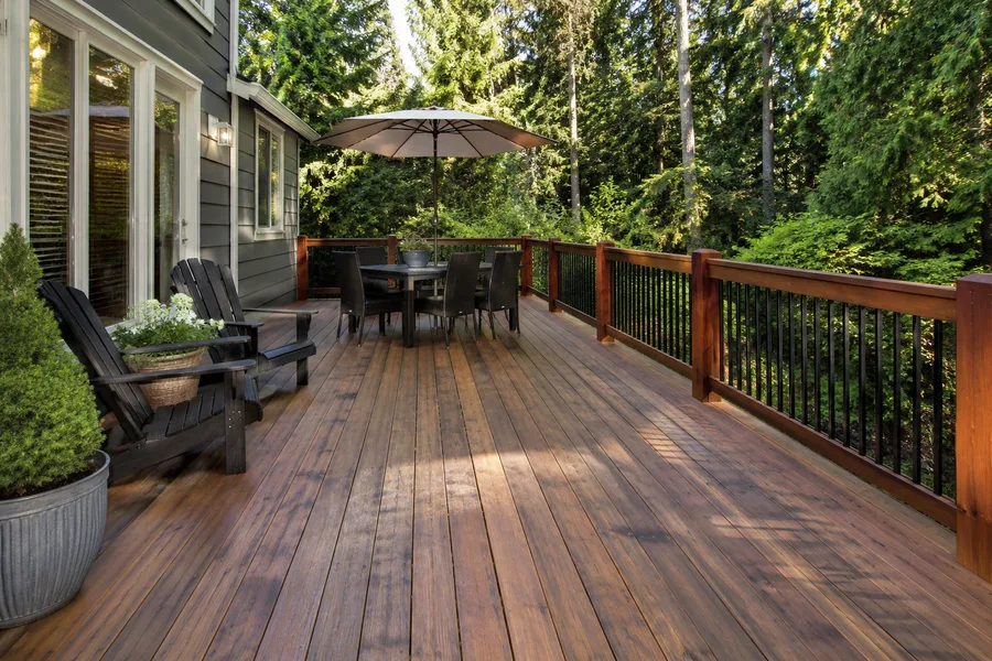 Restored deck with an even stained finish, timber railings and metal balusters