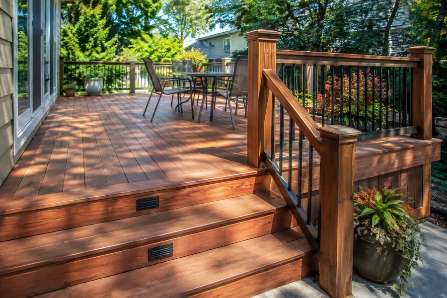 Restored deck and steps with a warm finish, lit risers and refinished railings