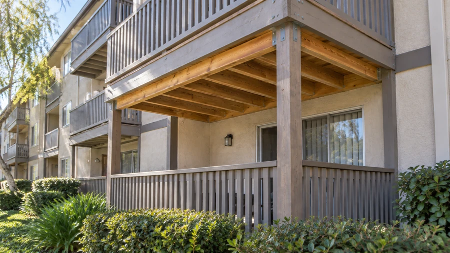 Rebuilt balcony underside with new joists and galvanised connectors at an apartment building
