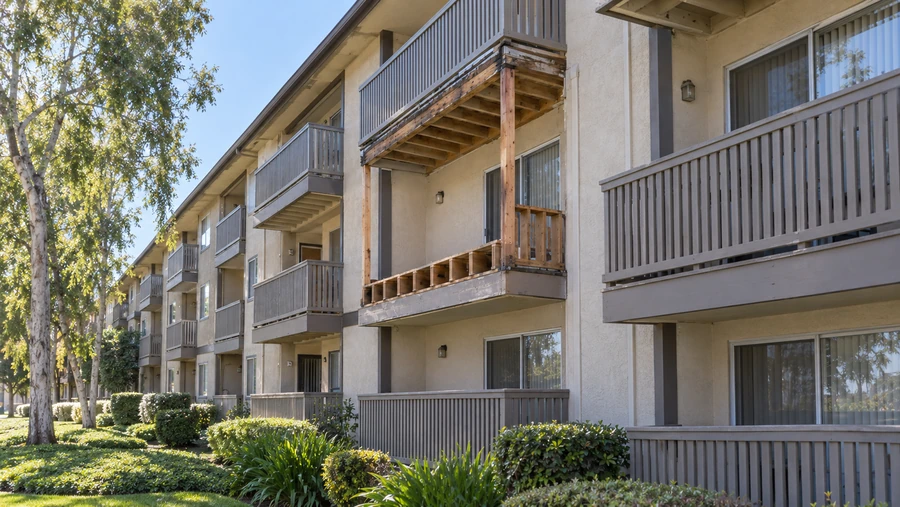 Balcony stripped back to posts and joists on an occupied apartment building