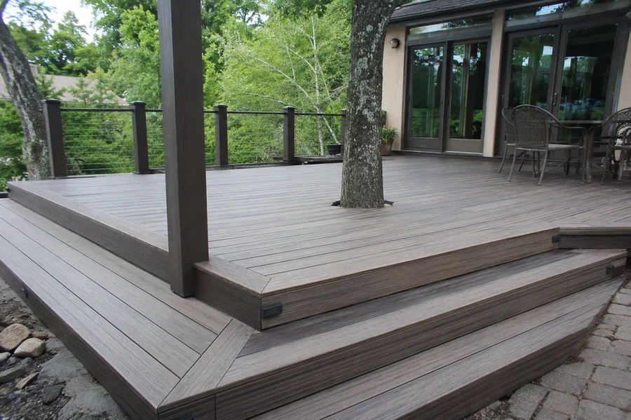 Weathered modified wood decking with a picture-frame border and cascading steps