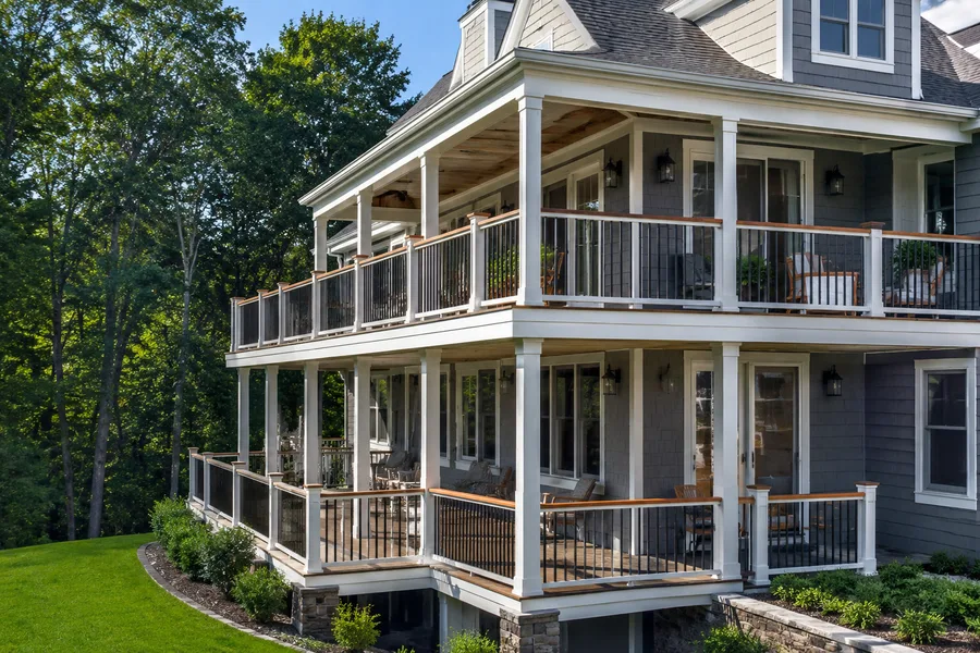 Stacked wraparound balconies running along two elevations of a building